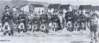 An image taken from a newspaper clipping. The housing layout and the uniforms put the parade (at a guess) in Rosneath around the 1970s