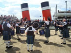 We normally provide a piper for the visit of the world-famous Paddle Steamer Waverley every weekend during the Summer months. It was forecast for a nice day, so we turned out a mini band instead. Approx July 2011.